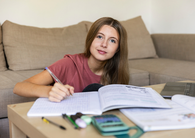 Student revising at home for her exams.