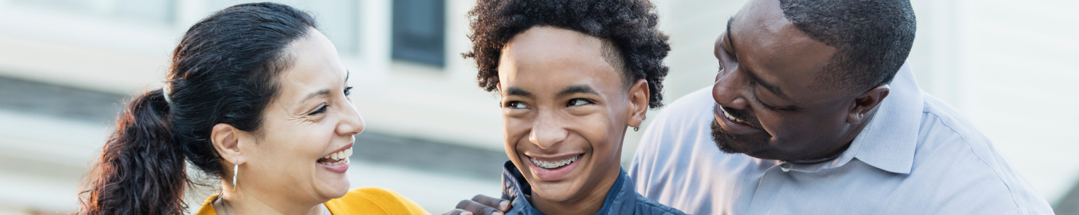 2 parents supporting their teenage son.